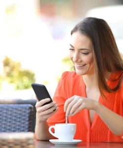 depositphotos_264530328-stock-photo-happy-woman-using-phone-stirring.webp